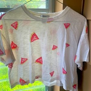 Cropped top white shirt with watermelon design.
